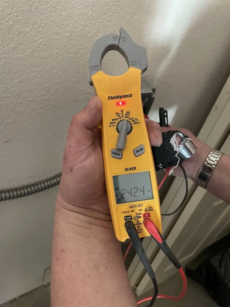 Voltage testing with clamp meter during Recessed Lighting Installation in West Whiteland